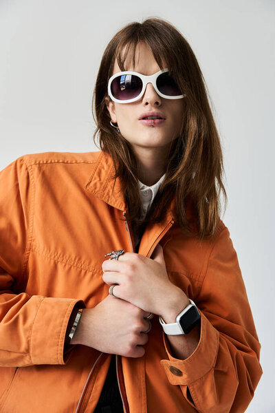 This young man showcases his unique fashion sense, blending modern trends and individual style.