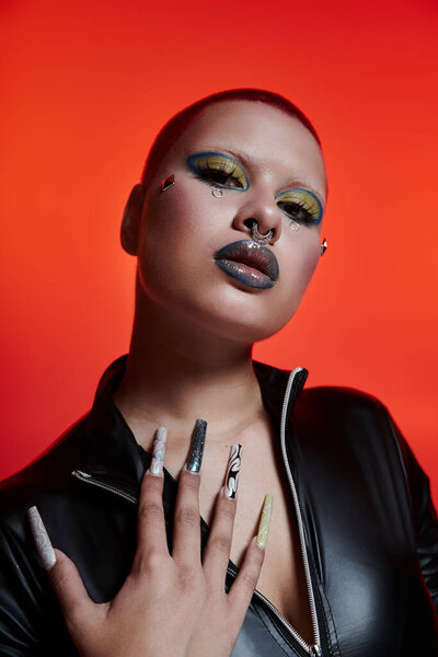 The young woman confidently exhibits her striking look, highlighted by colorful makeup and unique nails.
