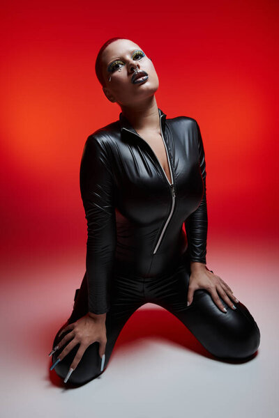 This striking individual showcases her daring fashion sense in a playful yet fierce studio atmosphere.