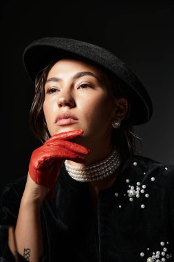 A young woman adorns herself with pearls and striking gloves, exuding elegance and style. clipart