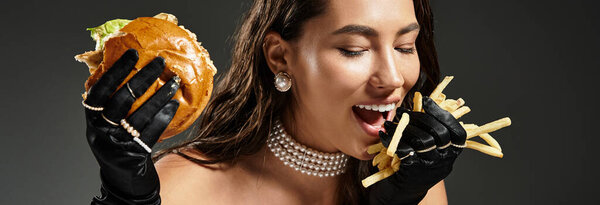 A sophisticated woman delights in a gourmet burger and fries, wearing elegant attire.