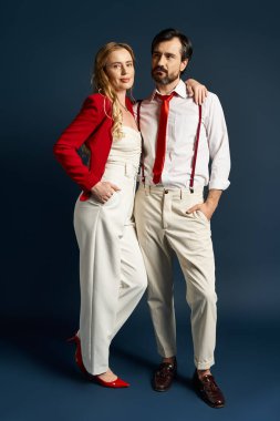 A fashion forward couple showcases their unique style with vibrant, contrasting outfits. clipart