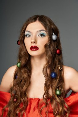 A young woman showcases holiday spirit with colorful ornaments in her hair and a vibrant outfit. clipart