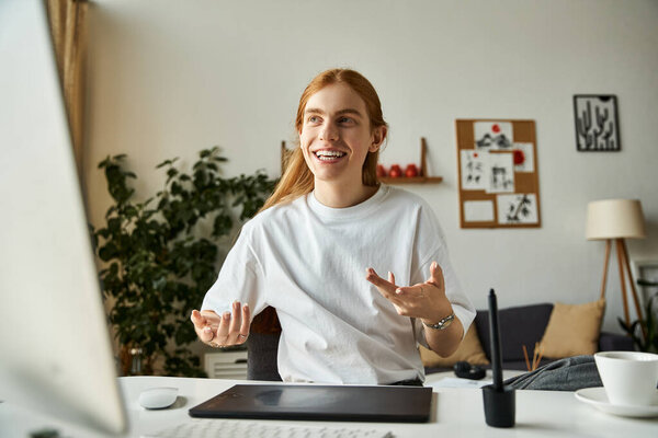 A young man joyfully discusses with enthusiasm in a contemporary, light filled office.