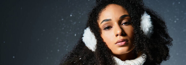 A stylish brunette woman embodies winter fashion with earmuffs, a faux fur jacket, and a cozy white sweater.
