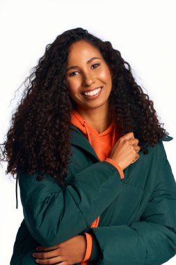 A joyful woman shines in style, wearing a cozy jacket for the winter season. clipart