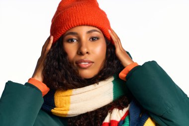 A stylish woman showcases her beauty in cozy winter wear, radiating confidence and warmth. clipart