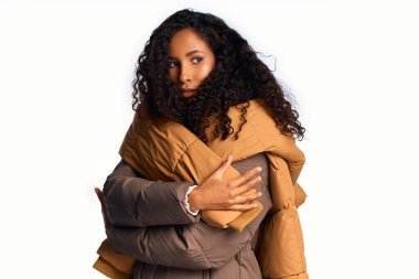 Stunning woman wrapped in stylish outerwear poses confidently, radiating elegance and warmth. clipart