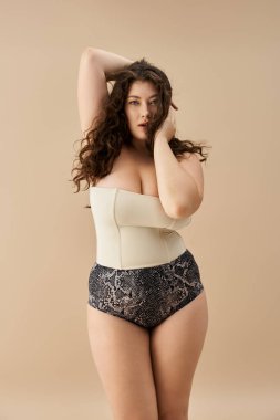 Bold plus size woman poses confidently in stylish lingerie, radiating beauty and self assurance. clipart