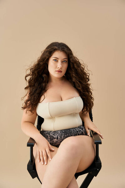 A confident young woman models fashionable underwear, radiating beauty and grace.