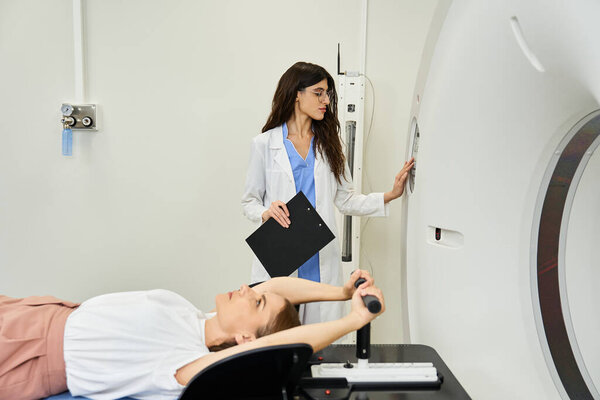 A skilled doctor monitors a patient while preparing them for an MRI scan in a healthcare facility.