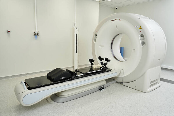 Cutting-edge MRI machine stands ready in a pristine hospital environment for diagnostics.
