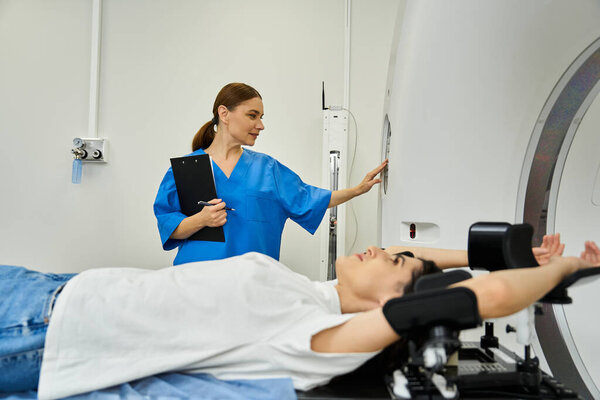 A doctor in a lab coat stands by as a patient prepares for an MRI scan in a hospital.