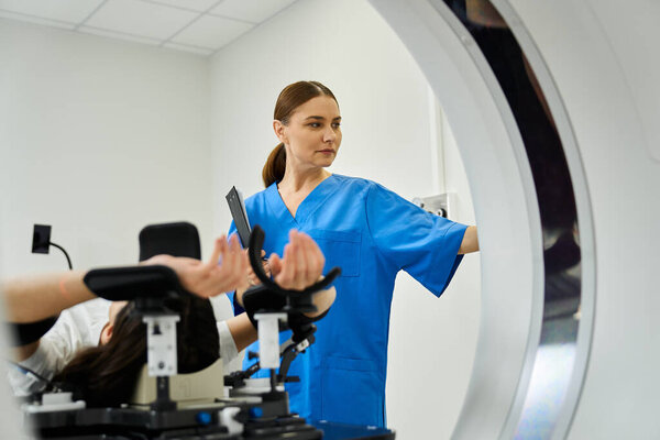 A female doctor in blue scrubs helps a patient enter the MRI, ensuring comfort and safety.