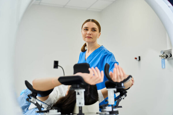 A dedicated doctor provides support to a patient undergoing an MRI scan in a hospital.