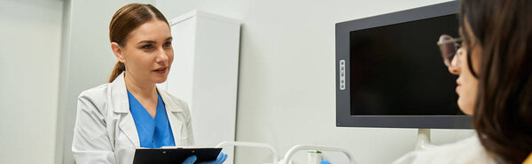 A gynecologist in a lab coat discusses health concerns with a female patient in a clinic.