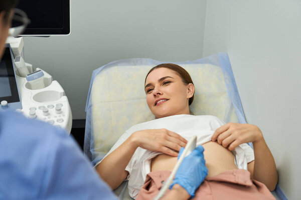 A skilled gynecologist conducts a patient examination focused on reproductive health.