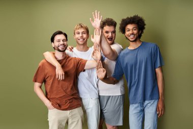 Four friends joyfully celebrate their LGBTQ identity in a lively, vibrant setting. clipart