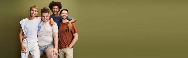 Four friends warmly embrace, celebrating love and vibrant queer identity in a joyful moment.