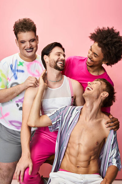 Friends share laughter and joy while dressed in bright attire, showcasing joy and unity.