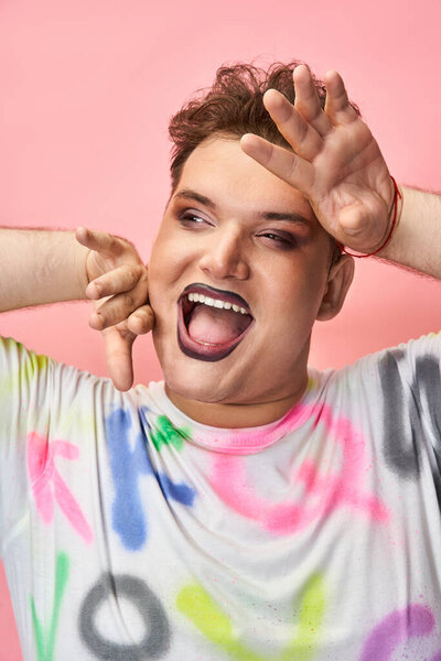 A person showcases excitement and confidence with colorful expressions in a playful pose.