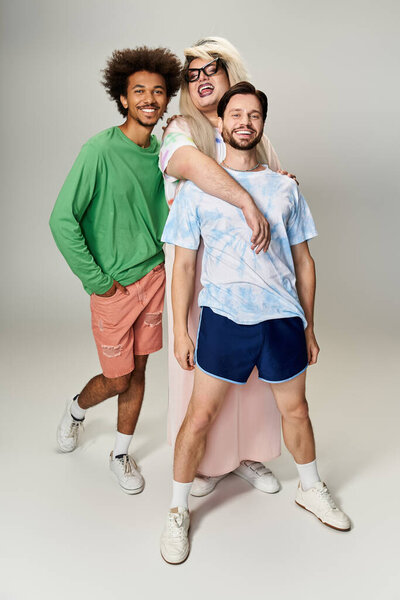 Three friends share laughter and joy, showcasing their vibrant personalities and pride spirit.