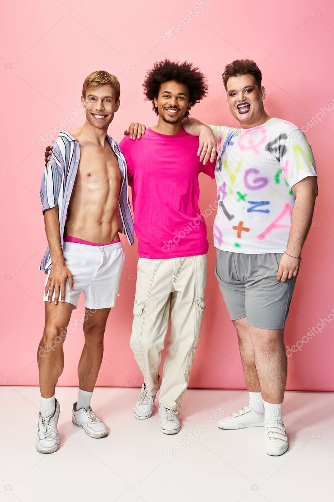Friends confidently pose in a vibrant setting, expressing joy and pride in their colorful outfits.