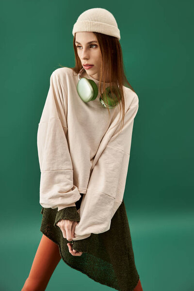 A young woman wearing oversized clothing poignantly showcases her battle with anorexia.