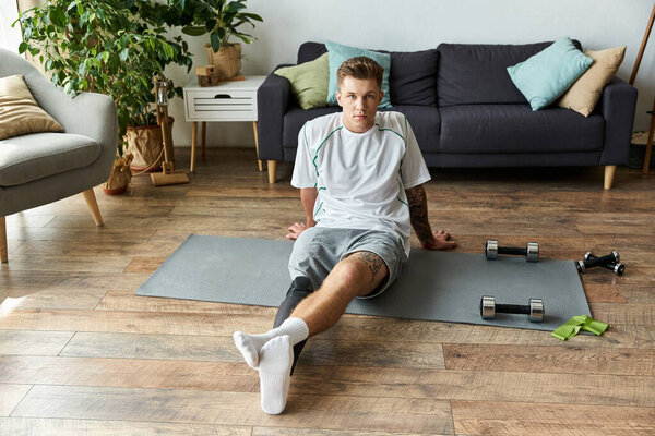 Motivated young man showcases determination and strength in his home fitness routine.