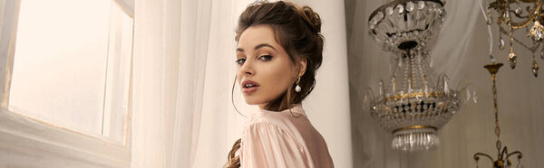 A young woman captivates with her ethereal presence in a vintage room filled with elegance.