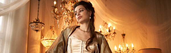 В роскошной освещенной комнате молодая женщина изображает очаровательного вампира с элегантностью и очарованием.