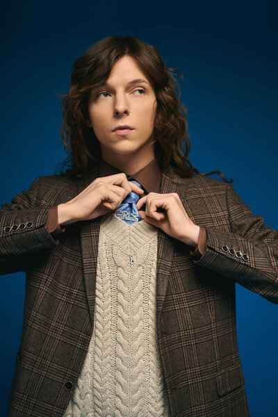 Fashionable young man prepares for an event, highlighting his modern sense of style and confidence.