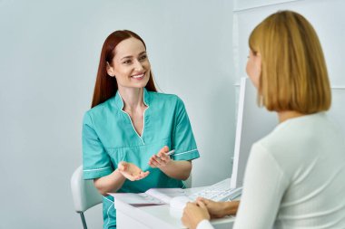 A young dermatologist smiles while discussing skin care options with a client in a modern clinic. clipart