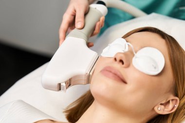 A young person relaxes during a dermatology procedure to improve skin health and appearance. clipart