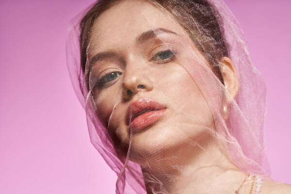 A woman exudes youthful beauty and style, captivating everyone around her.