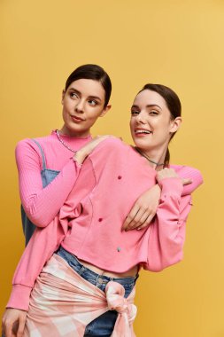 Two beautiful twin sisters pose together, showcasing their unique styles and playful smiles. clipart