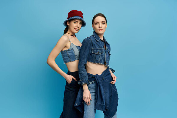 Two beautiful sisters express their striking fashion sense, radiating charm and confidence together.