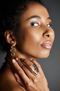 Beautiful African American woman adorned with stylish jewellery, radiating grace and confidence. clipart