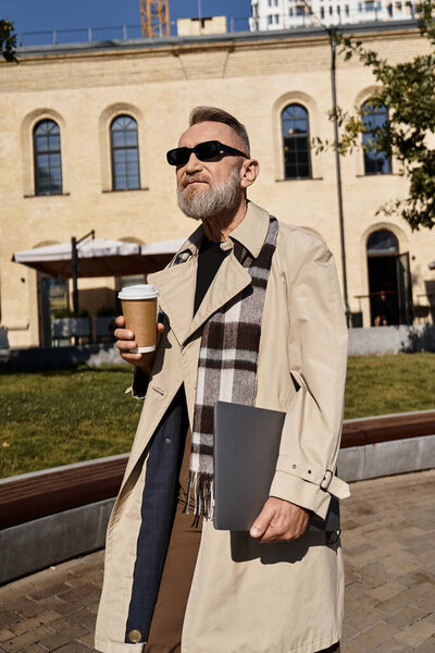 Walking through a vibrant city, a dapper senior man in fashionable attire enjoys a cup of coffee.