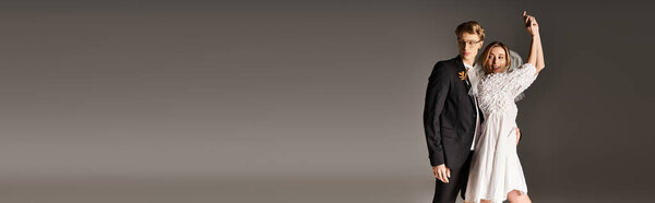 Young couple enjoys joyful moments together, embodying love in a romantic spring wedding, banner