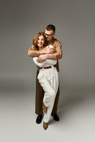A lovely bride and groom share a sweet moment, elegantly dressed and full of joy.