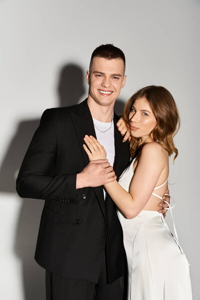 A lovely couple radiates joy and romance, showcasing their love and elegance.