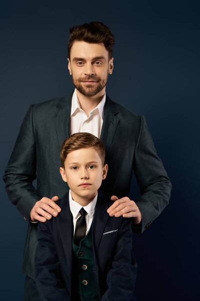 A father and son bond beautifully, dressed up, celebrating Fathers Day together with joy in 2025.