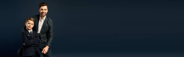 A father and son share a touching moment together, showcasing pride and love for one another.