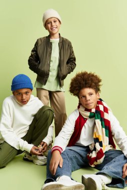 Three joyful boys show off their bright outfits while having fun together.