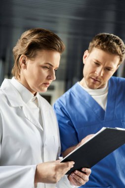 Two doctors review results together in a modern hospital environment focused on patient care.