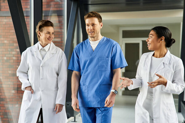 A diverse group of doctors engages in meaningful conversation within a contemporary hospital.