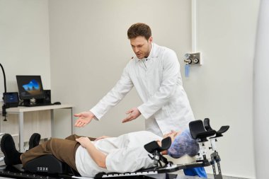 A skilled doctor explains the MRI process to a calm patient in a healthcare facility.