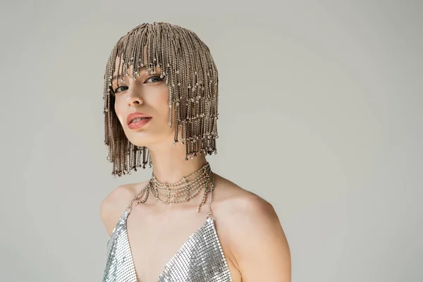 Fashionable woman in necklace and jewelry headwear isolated on grey — Fotografia de Stock