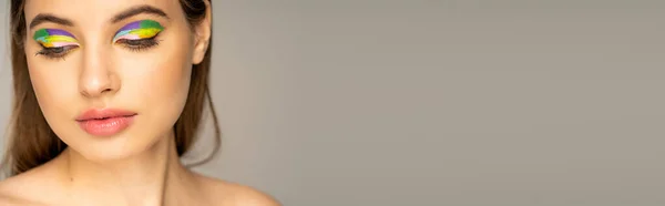Teen girl with colorful eyeshadows posing isolated on grey, banner — Stock Photo